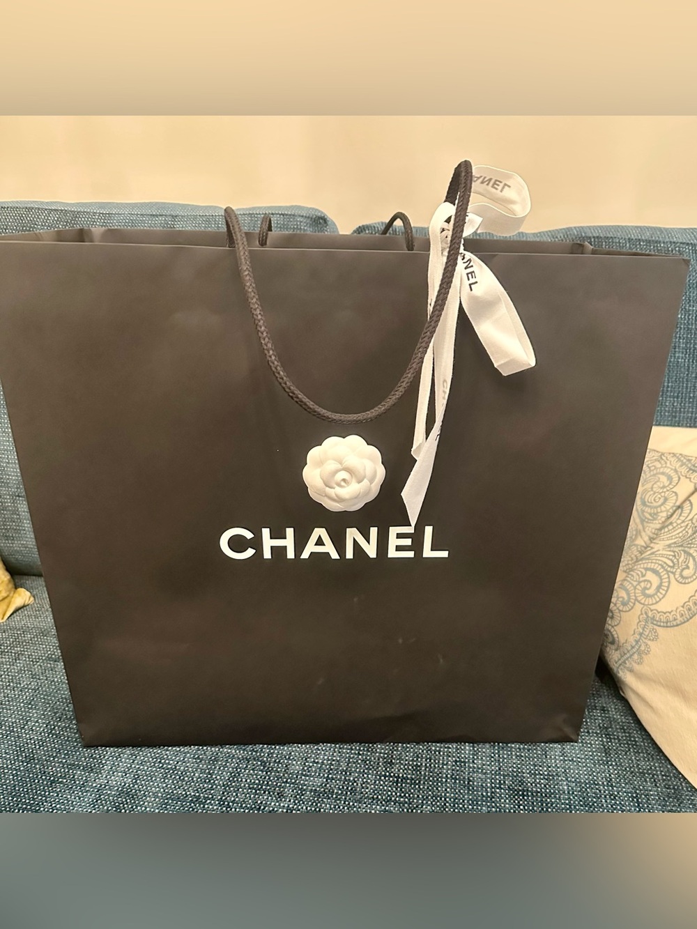 CHANEL Black Shopping Tote with White Camellia and Ribbon